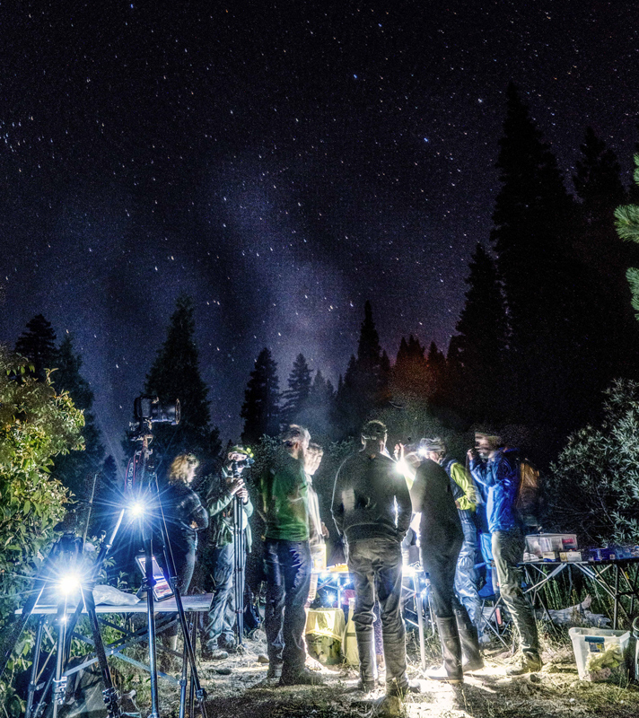 student researchers with field equipment at Sierra Nevada Field Campus during nighttime