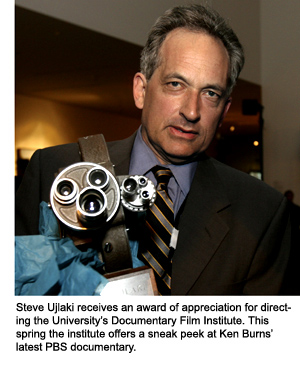 Steve Ujlaki holds an award in the shape of a film camera presented to him at an event sponsored by SF State’s International Center for the Arts
