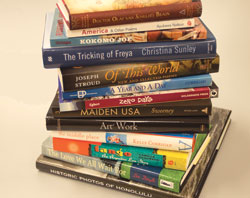 Close-up image of a stack of newly released books