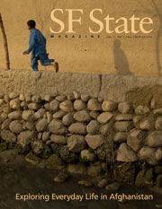 Cover of fall/winter 2010 magazine with a child running along desert street