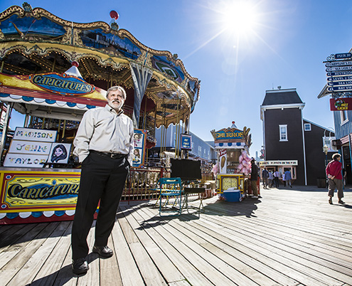 Alum Taylor Safford stands on the boardwalk at Pier 39. Photos by Eric Millette