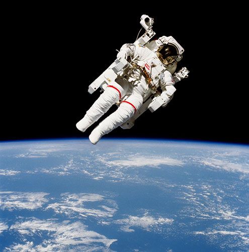 An American astronaut floats in space