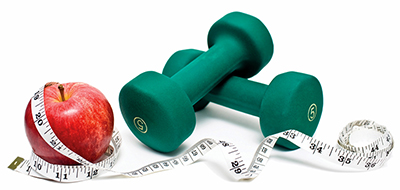 Stock photo of an apple, a tape measure and barbells