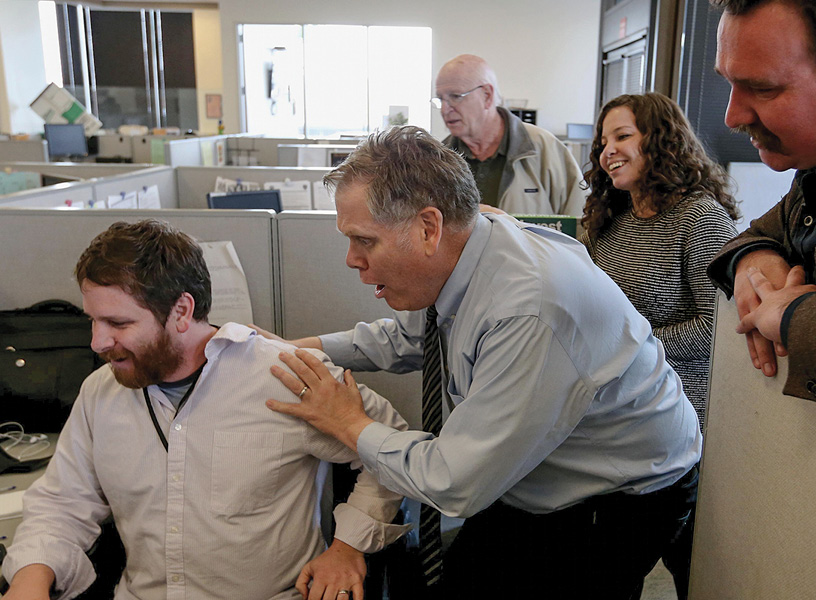 From left, East Bay Times reporters Matthias Gafni, Thomas Peele, Harry Harris, Erin Baldassari and <strong>David Debolt</strong> (B.A., ’09) react as they learn of their Pulitzer Prize win for breaking news at their office in downtown Oakland on Monday, April 10, 2017.