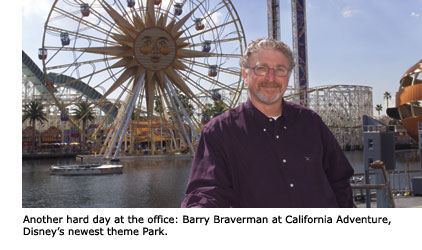 Disney imaginer and SFSU alumnus Barry Braverman stands before a large ferris wheel at California Adventure, Disney's newest theme park.
