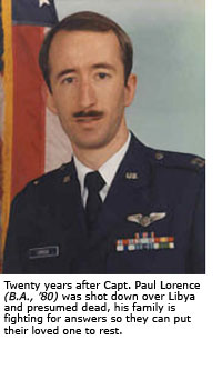 A headshot of Capt. Paul Lorence dressed in his Air Force Uniform with an American flag in the background.