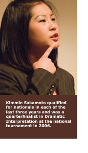 Kimmie Sakamoto points her index finger toward her chin, appearing to contemplate a new idea.