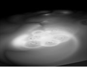An animated version of a vat of white milk, surface bubbles exaggerated in size.