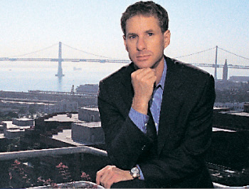 Chris Larsen, with the Bay Bridge in the background
