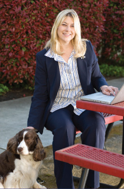 Liz Ellis with her dog, Cody, at her feet