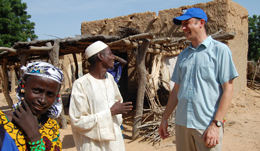 Photo of Scott Webb talking with a villager in southwestern Niger