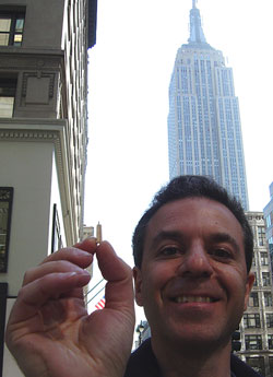 Steven Backman holding his toothpick version of the empire state building