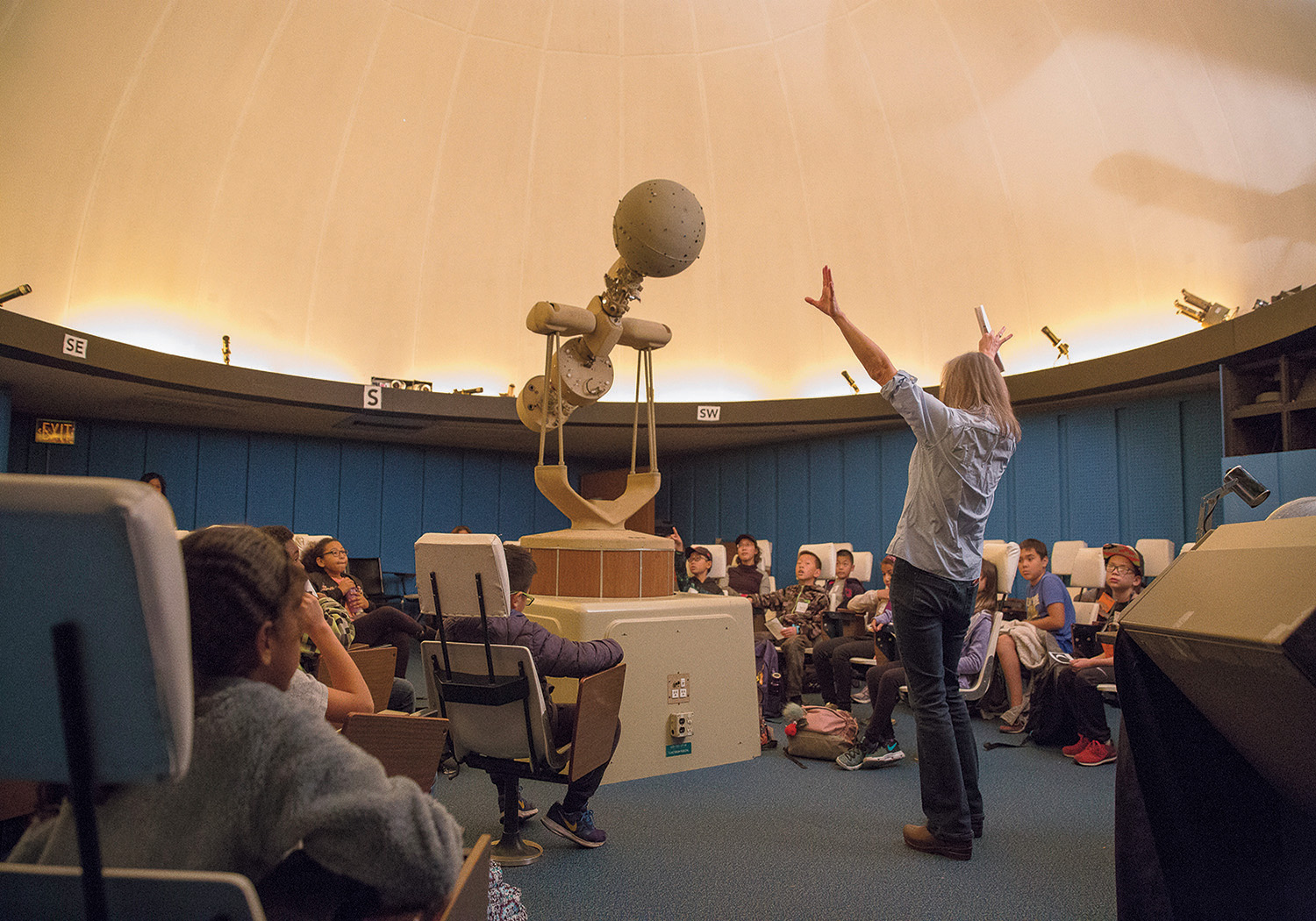 Professor Cool introduces young visitors to the planetarium (above) and the constellations.