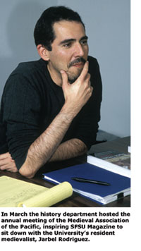 Professor Jarbel Rodriguez smiles during the seminar he teaches on The Black Death