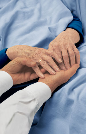 A photo of a man’s hand holding an elderly woman’s handA photo of a man’s hand holding an elderly woman’s hand