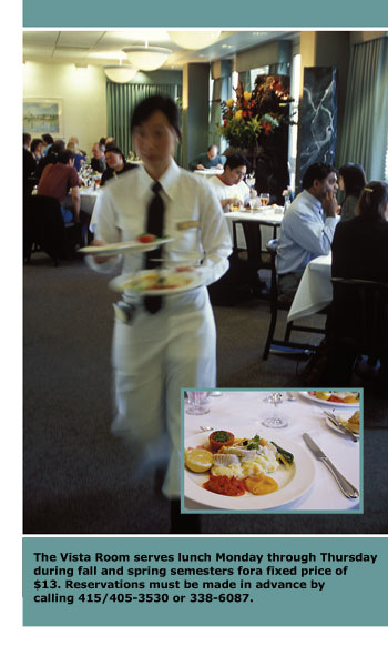 A busy student waiter rushes back to the kitchen with two plates of food in hand