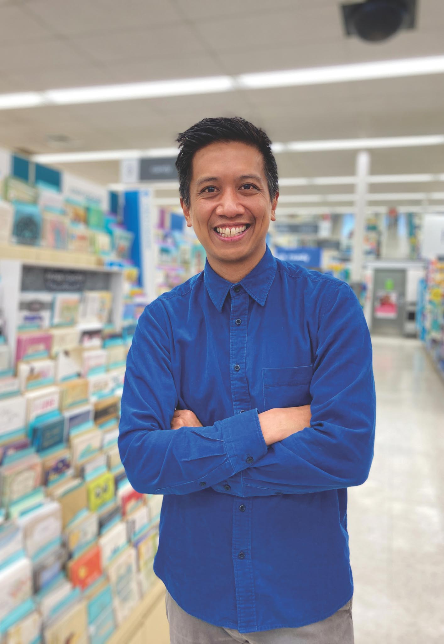 Alumna Anthony Doctolero in the gift card aisle of a store