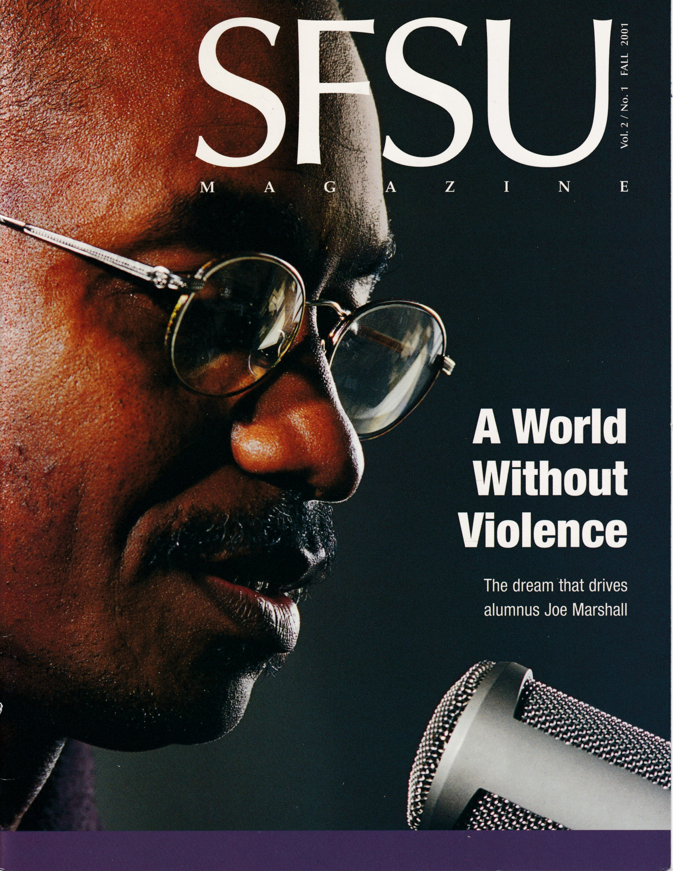 Close up of Joe Marshall speaking into a mic