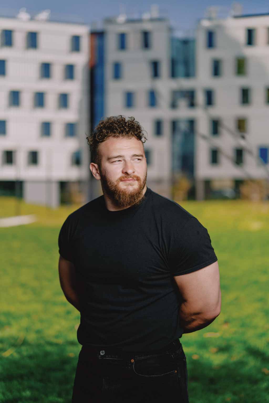 Julian Dancel in front of new student housing West Grove Commons