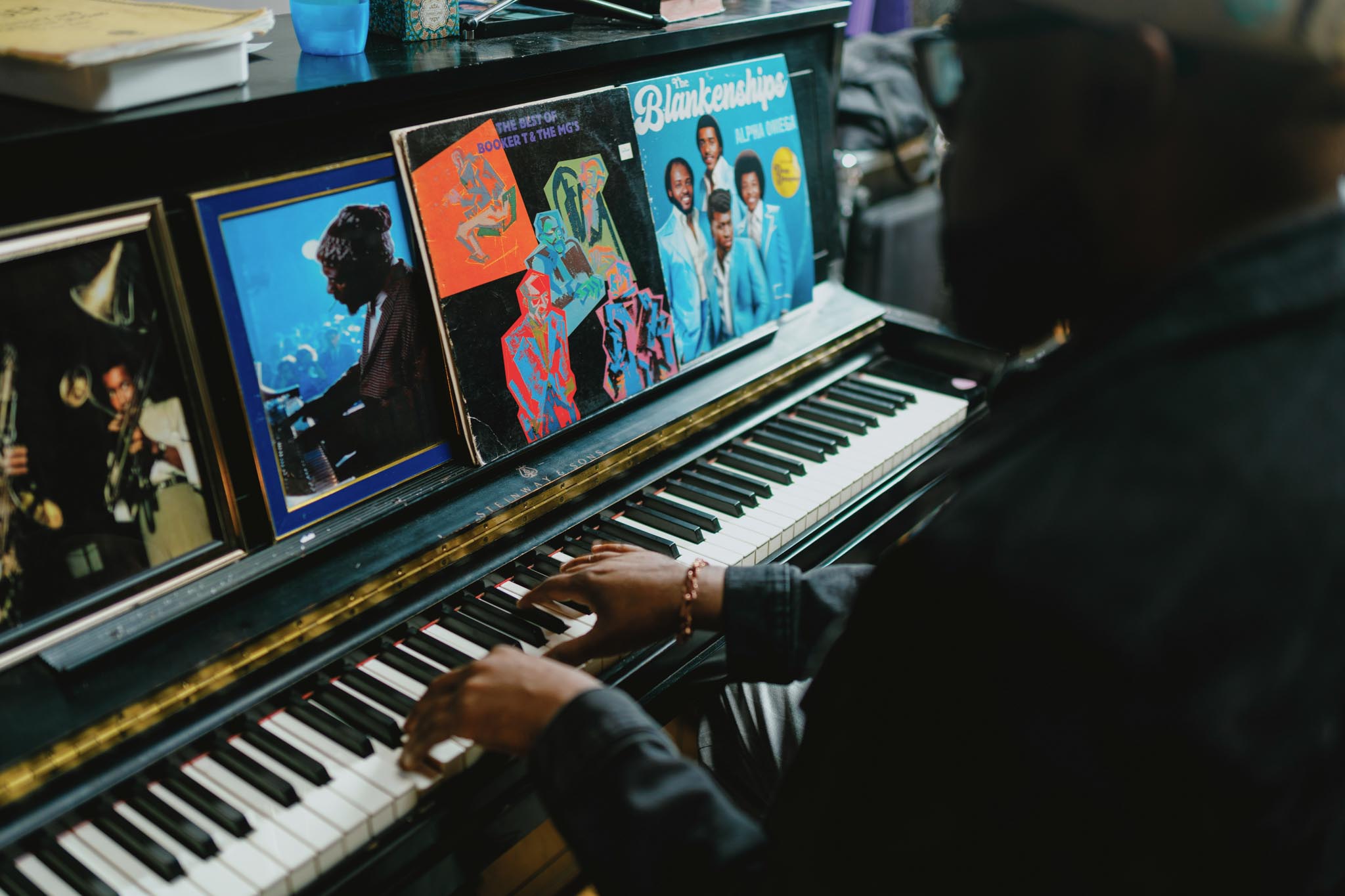 Over the shoulder point of view of Mike Blankenship playing the piano