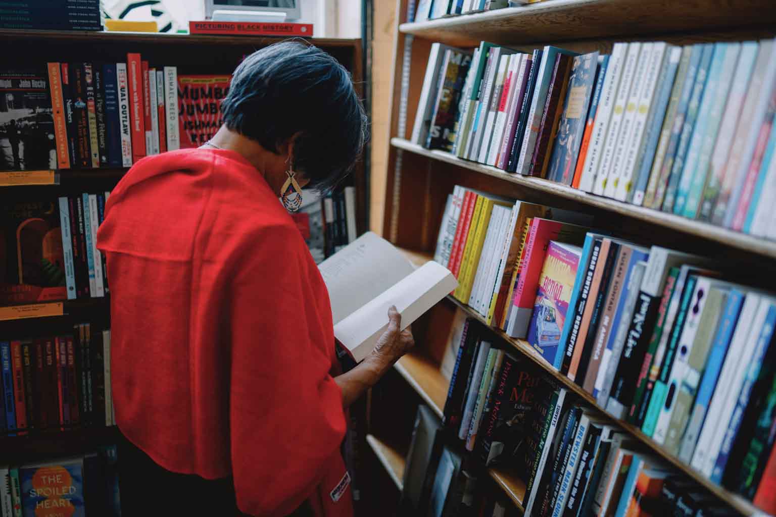 Genny Lim reading a book