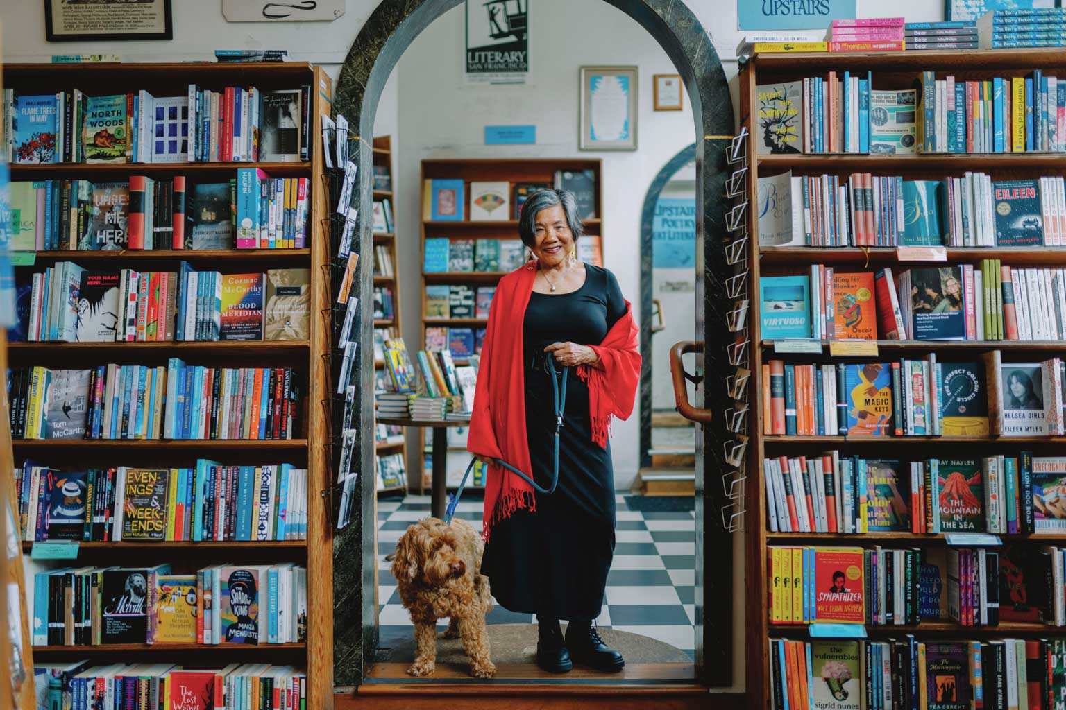 Genny Lim and her dog walk around the book store