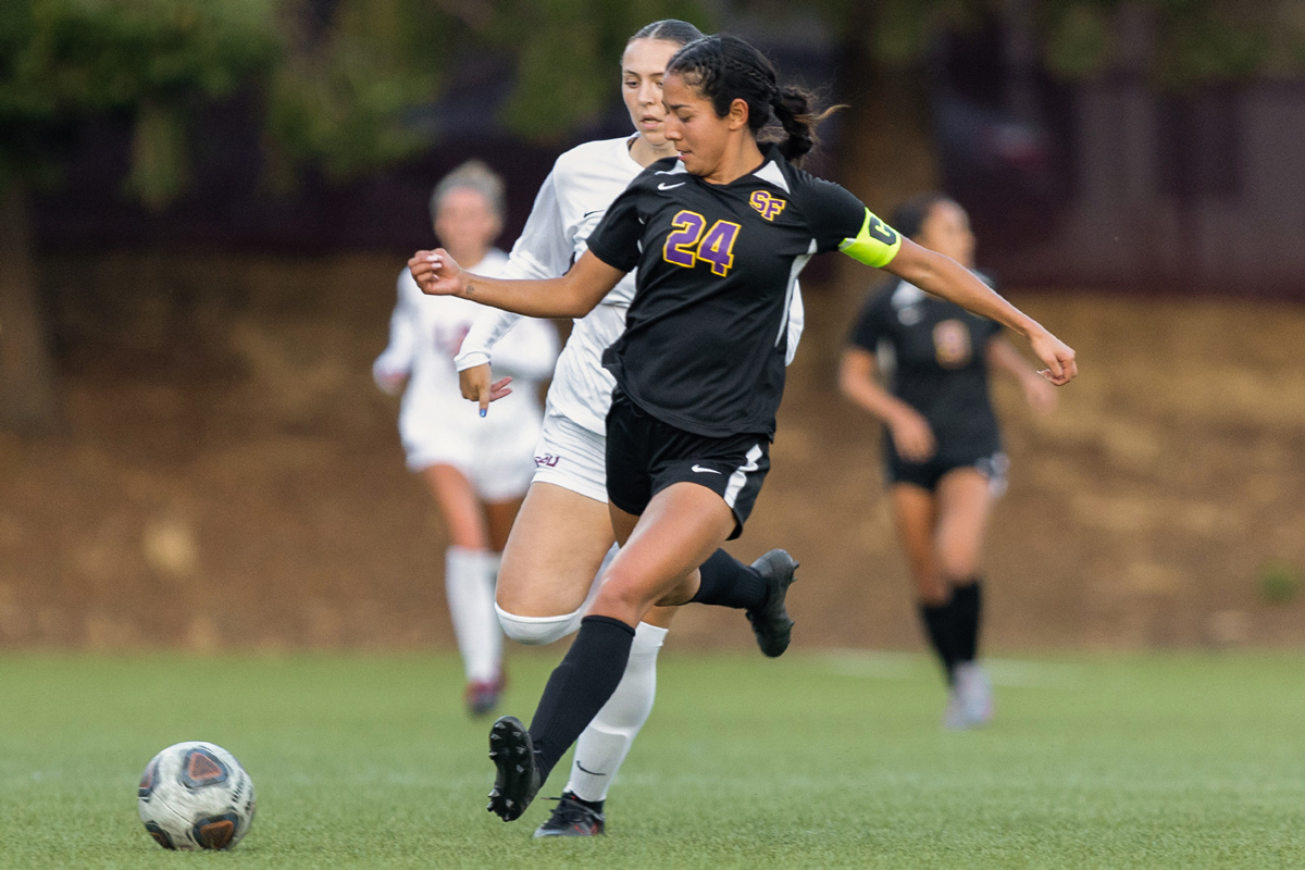 Gator soccer player kicking the ball