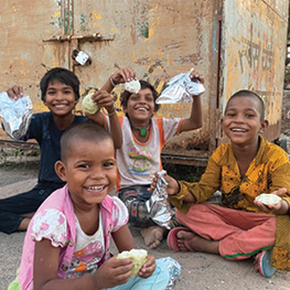 Children holding up snacks