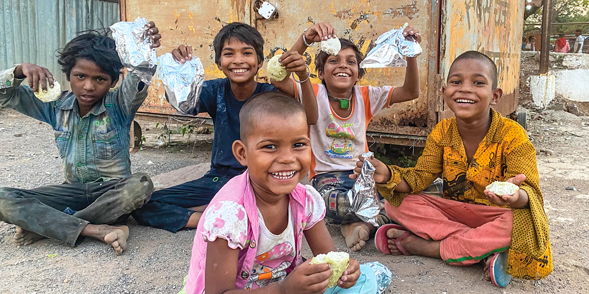 Children holding up snacks