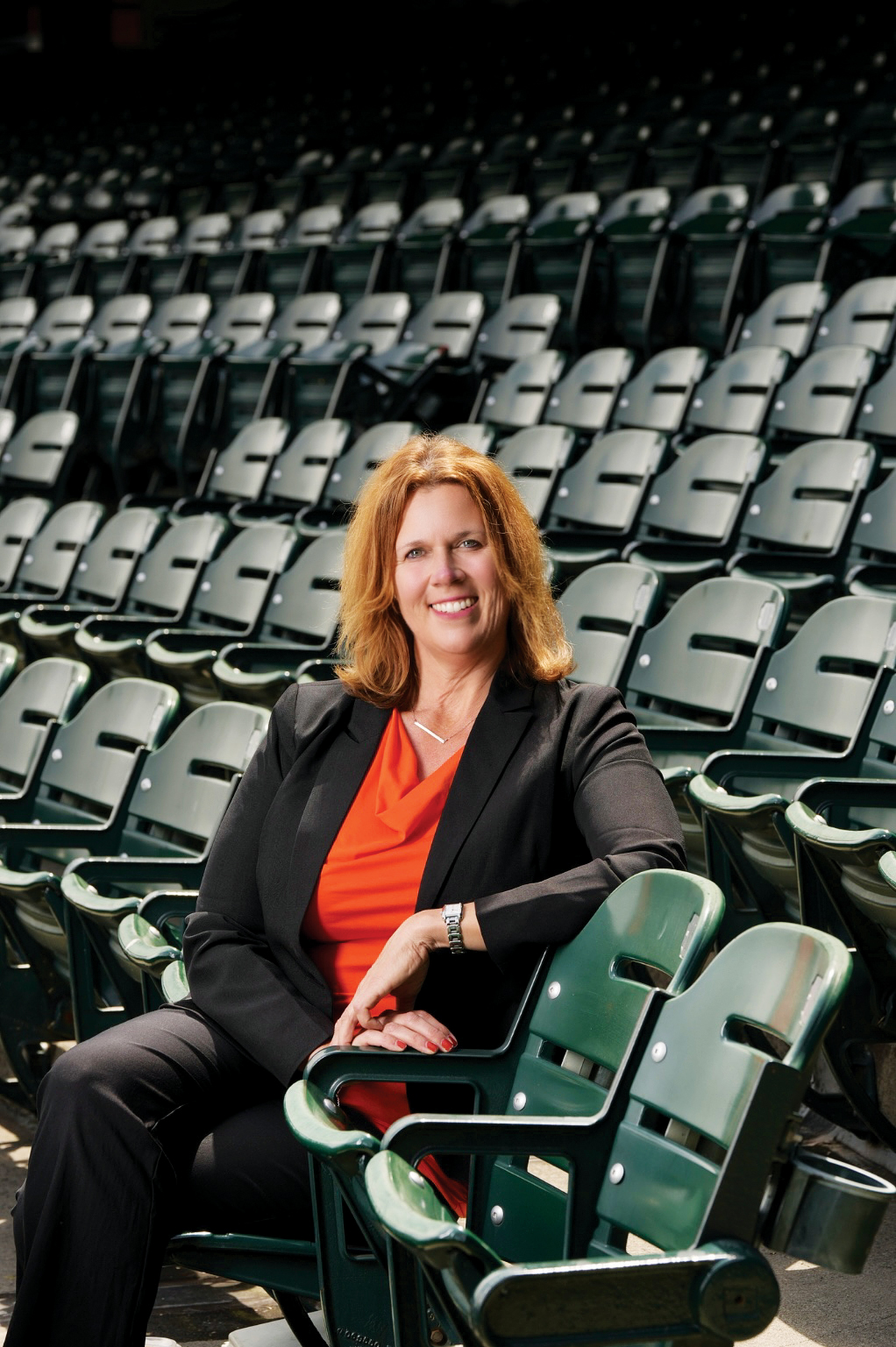 Giants on-air personality and SFSU alumna Carolyn McArdle sitting in the Oracle Park seats