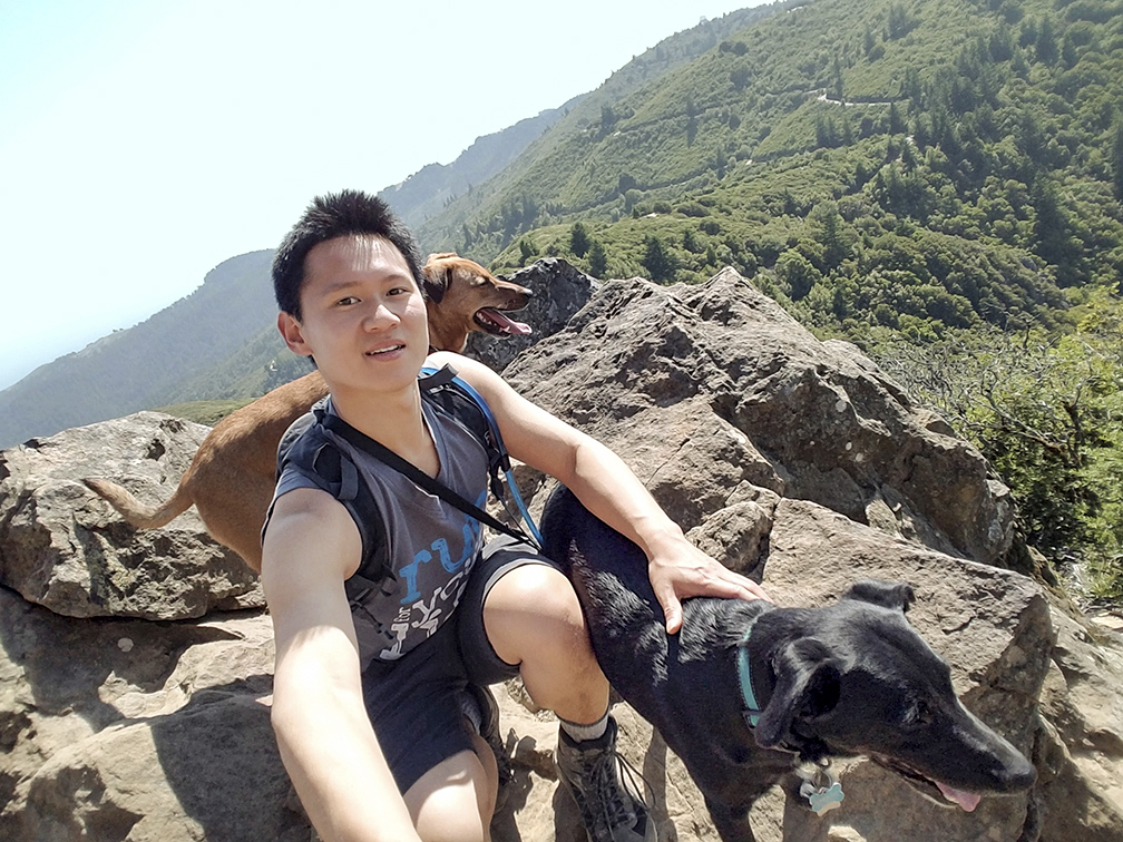 Raymond Wang with his rescue dogs, Peanut and Cody