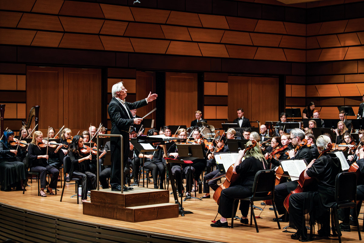 Wes Kenney conducting an orchestra