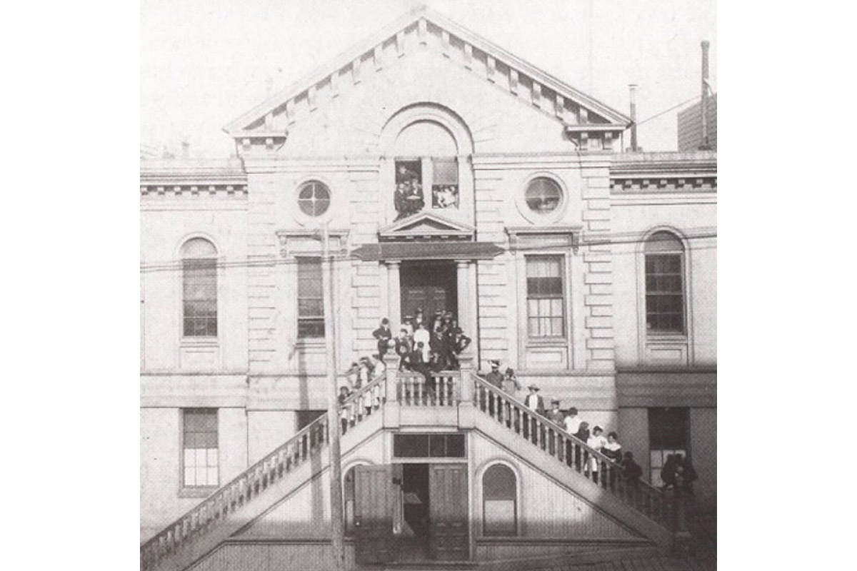 First graduating class of SFSU on staircase outside of building