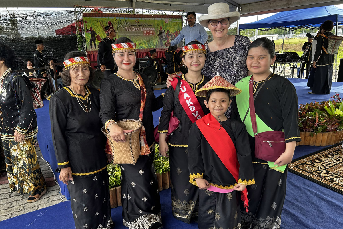 Ambassador McClelland with 5 ladies in cultural garb