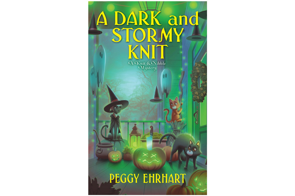 cover art for "A Dark and Storm Knit" showing a comical illustration of 3 cats surrounded by halloween decorations on a porch and glowing lights surrounding the area